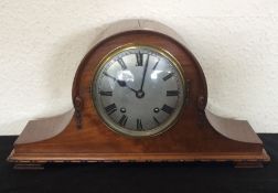 A mahogany Nelson's hat clock with silver dial.
