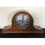 A mahogany Nelson's hat clock with silver dial.
