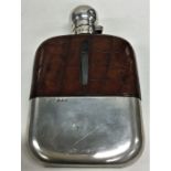 A massive silver and crocodile skin hip flask with