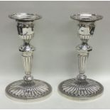 A pair of silver Adams' style tapering candlesticks.