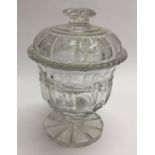 An Antique cut glass jar and cover on circular bas