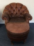 A leather button back armchair together with match