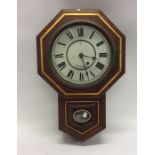 A mahogany cased clock with white enamelled dial.