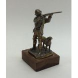 A good quality cast silver figure of a man shootin