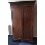 An Edwardian mahogany two door wardrobe. Est. £30