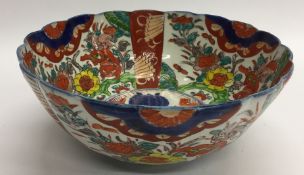 An Imari fruit bowl decorated with bright flowers.