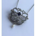 A massive Russian sapphire and diamond pendant on