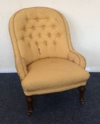 A Victorian button back nurse's chair on turned su