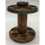 A large wooden bobbin flange with metal mounts. Es