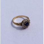 A good sapphire and diamond circular cluster ring