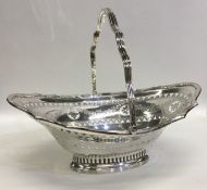 A good Georgian style silver swing handled basket