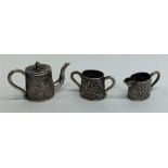 An unusual miniature Japanese silver tea set with