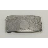 A small silver card case decorated with flowers an