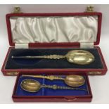 Two boxed silver gilt apostle top spoons decorated