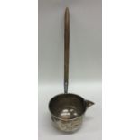 A rare silver toddy ladle with tapering handle and