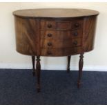 A mahogany demi lune sewing box with fitted interi