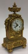 A French brass mantle clock attractively decorated