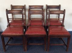 A set of six mahogany dining chairs with inset sea