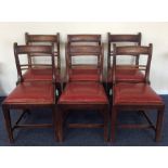 A set of six mahogany dining chairs with inset sea