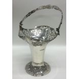An Edwardian silver swing handled basket decorated