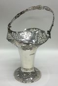 An Edwardian silver swing handled basket decorated