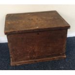 A small pine hinged top trunk. Est. £20 - £30.