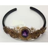 A heavy high carat gold and amethyst tiara on velv