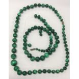 Two graduated strings of malachite beads. Est. £20