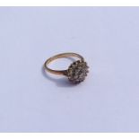 A modern 9 carat diamond daisy head cluster ring.