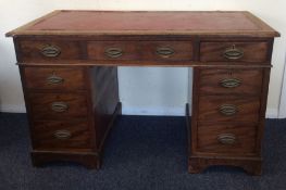 A Georgian mahogany nine drawer twin pedestal desk