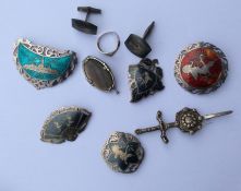 A collection of silver and enamel brooches, cuffli
