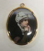 An oval miniature of a lady with headdress. Est. £