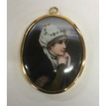 An oval miniature of a lady with headdress. Est. £