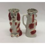 A pair of Staffordshire begging Spaniel jugs both