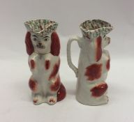 A pair of Staffordshire begging Spaniel jugs both