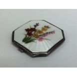 A square silver and enamel compact decorated with