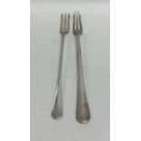Two OE pattern silver pickle forks of typical desi