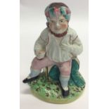 A good Staffordshire figure of a seated gentleman