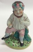 A good Staffordshire figure of a seated gentleman