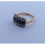 A sapphire and diamond three row ring within a cla
