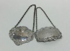 Two Edwardian silver wine labels decorated with sc