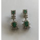 A good pair of emerald and diamond cocktail earrin