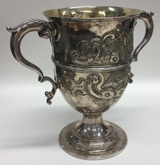 A large Georgian silver and embossed two handled t