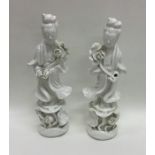 A pair of Chinese decorated figures in standing po