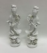 A pair of Chinese decorated figures in standing po