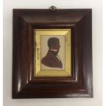 A pair of rosewood framed silhouettes with gilt bo