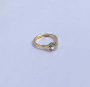 A diamond single stone mounted as a ring in two co
