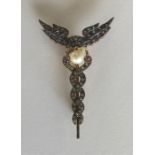 A diamond and pearl brooch with pierced decoration