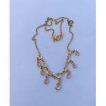 An 18 carat moonstone fringe necklace with loop cl