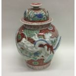 A Chinese pottery vase decorated with dragon and f